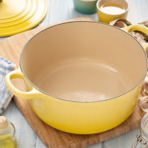enameled cast iron pot on a wooden table